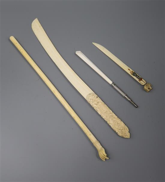 An Indian ivory backscratcher and three paperknives